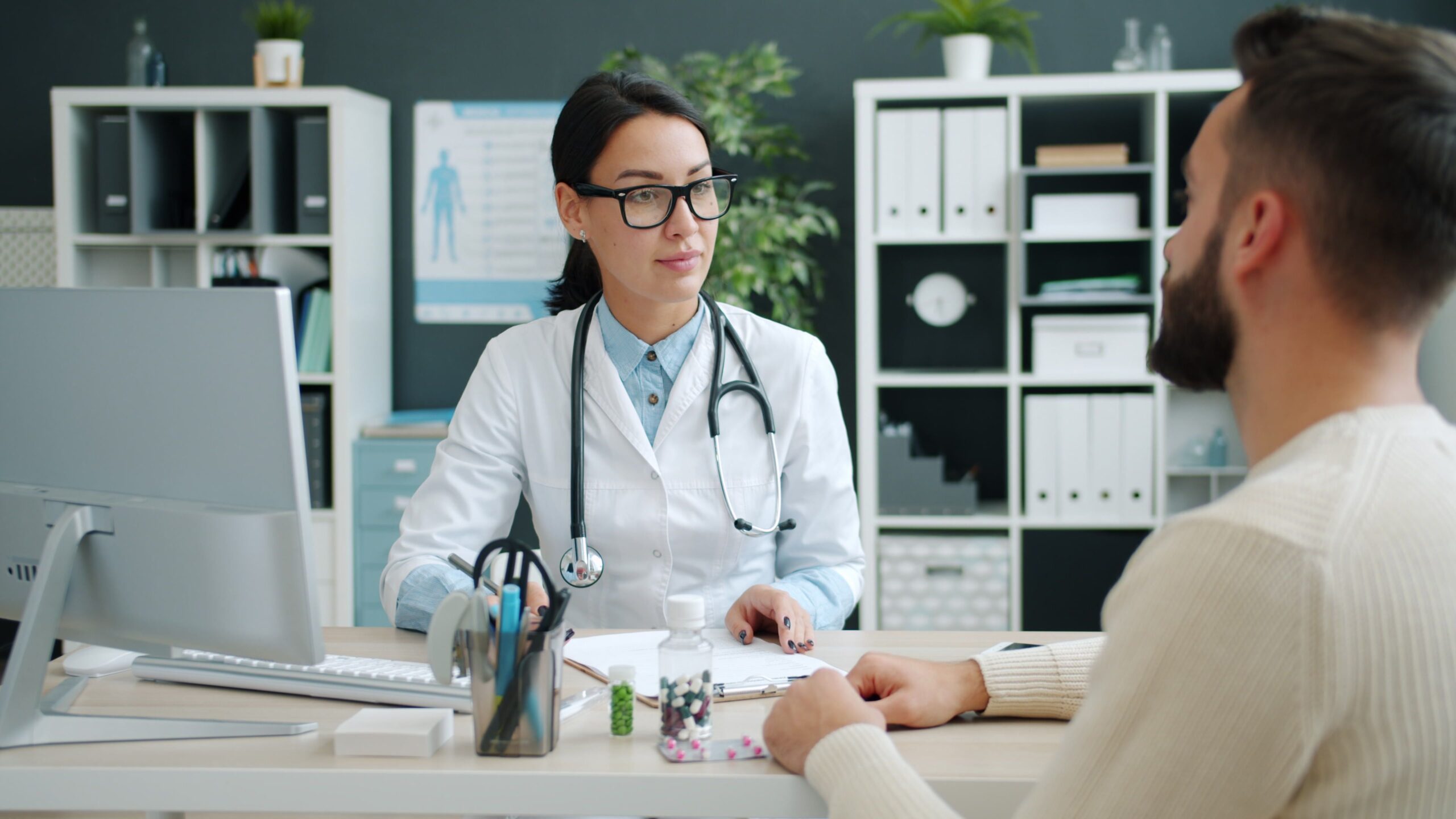 Clinician discussing GLP-1 medication options with a patient during a consultation
