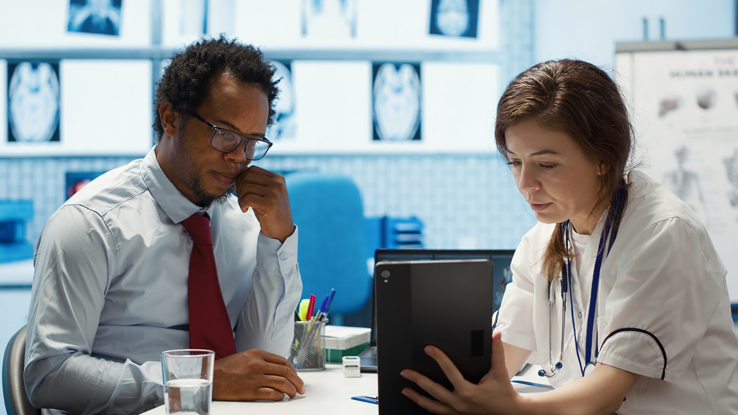 Clinician reviewing GLP-1 clinical trial data with a patient on a tablet